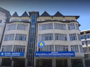a building with a sign on the front of it at Kalinga Intercontinental By Maa Vaishno Hotels India Pvt Ltd in Manāli