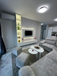 a living room with a couch and a table at Sunset Apartment in Orikum