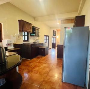 a kitchen with a stainless steel refrigerator in a room at Lovely Home in Panadura