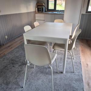 a white table and chairs in a room at Chalet Les Allores Dohan (Bouillon) in Bouillon