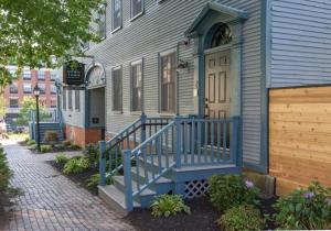 a blue house with a blue door and a porch at THE INN DOWNTOWN - Portsmouth, NH in Portsmouth