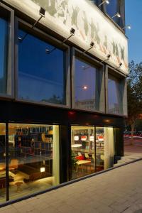 a building with a lot of windows on the side at citizenM Amsterdam South in Amsterdam