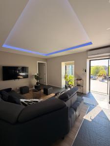 a living room with couches and a blue ceiling at Living Viana do Castelo in Viana do Castelo