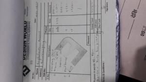 a white book with a drawing of a door at Bagchandi resort in Kathmandu +2 photos