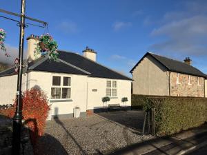 a white house with a black roof at Bon Accord in Fort Augustus