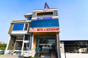 a building with a sign that reads wild and restaurant at FabHotel The Backyard Bowl in Indore