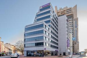 a tall building with a sign on top of it at Premier Inn Hannover City Centre in Hannover