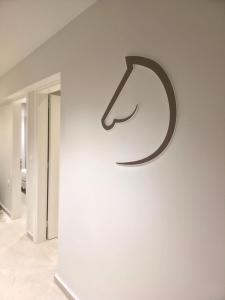 a sign on a wall in a room at 2BR Apartment for 5 in Archangelos Rhodes with Parking - Equus Sky in Archangelos +11 photos