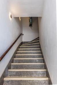 a stairway in a building with a stair case at Birkirkara Typical 2BDR Townhouse in Birkirkara