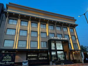 a hotel with a building with a hotel insurer at Hotel Avnish Near To Tajmahal in Agra