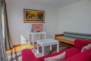 a living room with a couch and a table at GuestReady - Santo Amaro apartment in Vila Franca do Campo