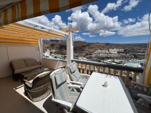 a balcony with a table and chairs and a view at Vista Mar in Mogán