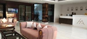 a living room with a couch and a counter at Hotel Avnish Near To Tajmahal in Agra
