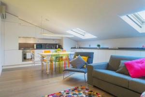 a living room with a couch and a table at Loft Della Baia a Due Passi dal Mare in Sestri Levante +15 photos