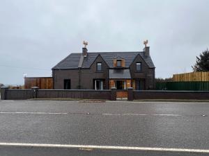 a house on the side of a road at BELLFIELD HOUSE in Broadford
