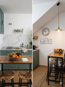a kitchen with a table with a bowl of fruit on it at le voltine in San Damiano dʼAsti