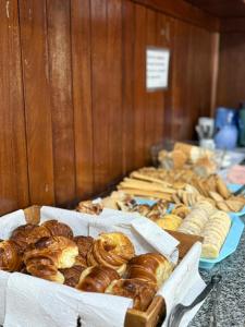 a bunch of donuts and other pastries on a table at HOTEL DIAMANTE in Resistencia