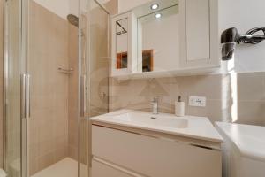 a bathroom with a sink and a shower at Casa Marida tra Cotoncello e Sant'Andrea - Goelba in SantʼAndrea +22 photos