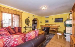 a living room with a couch and a piano at House Back to nature in Drniš
