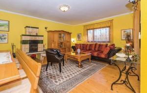 a living room with a couch and a table at House Back to nature in Drniš