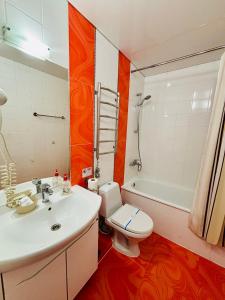 a bathroom with a sink and a toilet and a tub at Terasa in Stanishovka +45 photos
