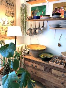 a kitchen with a bowl on a wooden table at Domaine Le Berdoy in Montesquiou