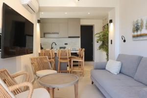 a living room with a couch and a table at VF34 Patio House in Ermoupoli