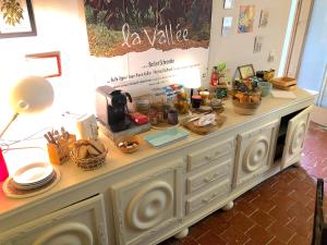 a buffet with dishes and other items on it at Domaine Le Berdoy in Montesquiou +63 photos