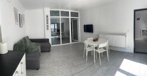 a living room with a table and a couch at Cazare Barlad 5 in Bîrlad
