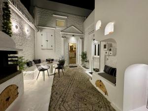 a large living room with a table and chairs at Traditional Villa Sofia in Koskinou