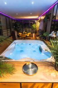 a hot tub in the middle of a room at Complex Rediu 54 - Penthouse Nr. 41 in Iaşi