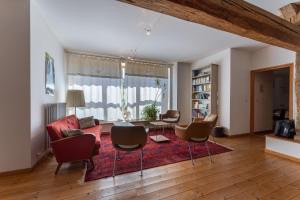 a living room with chairs and a table at Entre Loue et Lison in Amondans