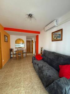 a living room with a couch and a table at Apartment Vicente casa 119 in Torrevieja