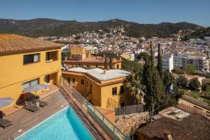 a view of a house with a swimming pool at Feelathome Vil-la Romana in Tossa de Mar