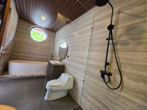 a bathroom with a toilet and a sink and a shower at Hey-Sola Bali ,3BR Luxury Private Villa Near Canggu in Dalung +16 photos