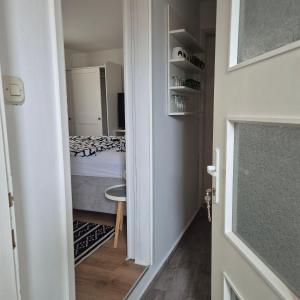 a door to a bedroom with a bed in a room at Roko Apartments in Biograd na Moru