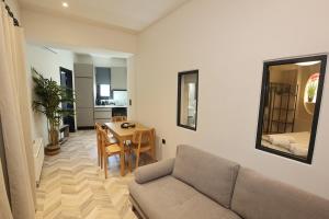 a living room with a couch and a table at VF34 Seaview House in Ermoupoli +49 photos