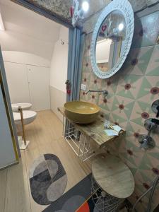 a bathroom with a sink and a mirror at Il Cuore di San Cipriano in Mesagne