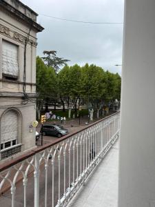 a view from a balcony of a street with a car at Apartamentos Plaza Minas in Minas