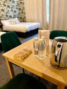 a table with bread and water bottles on it at Piccolo in Glasgow +1 photo