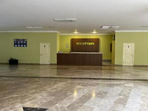 a waiting room with a reception desk in a building at Arena Hotel Tovuz in Tovuz
