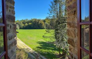 an open window with a view of a field at La Vieille Forge in Sarrazac +36 photos