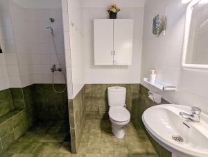 a bathroom with a toilet and a sink at El setè cel in Malgrat de Mar +15 photos