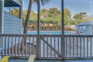 a view of a swimming pool from a balcony at 104 Inlet Sands Condo in Inlet Beach