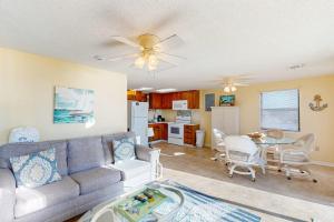 a living room with a couch and a table at Halsell's Hideaway in Indian Pass