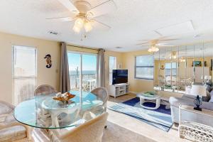a living room with a glass table and chairs at Halsell's Hideaway in Indian Pass +17 photos