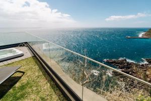 a view of the ocean from the balcony of a house at GuestReady - Stay with stunning views in Santa Cruz