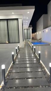 a lobby with a row of lights on the floor at شاليه بيرلا in Jeddah +5 photos