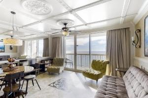 a living room with a couch and a table at Pelican Beach Resort 1502 in Destin
