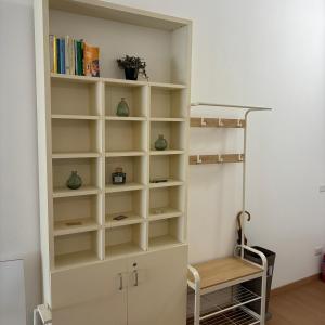 a room with a book shelf and a ladder at Bagaini Urban Flat in Varese
